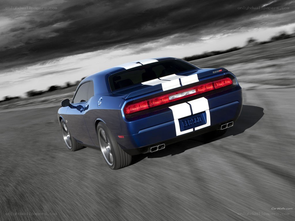 blue dodge challenger in motion