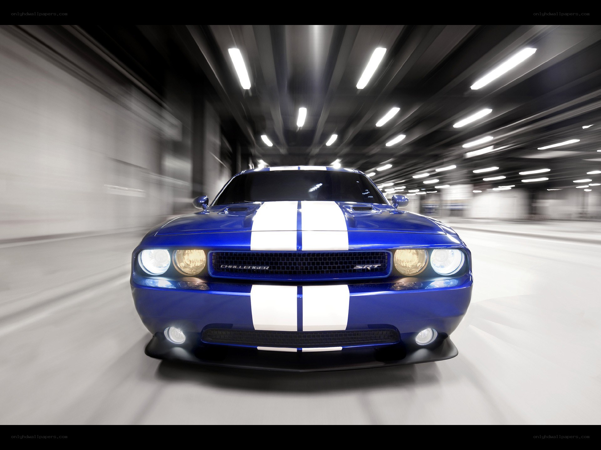 Blue Dodge Challenger SRT in motion