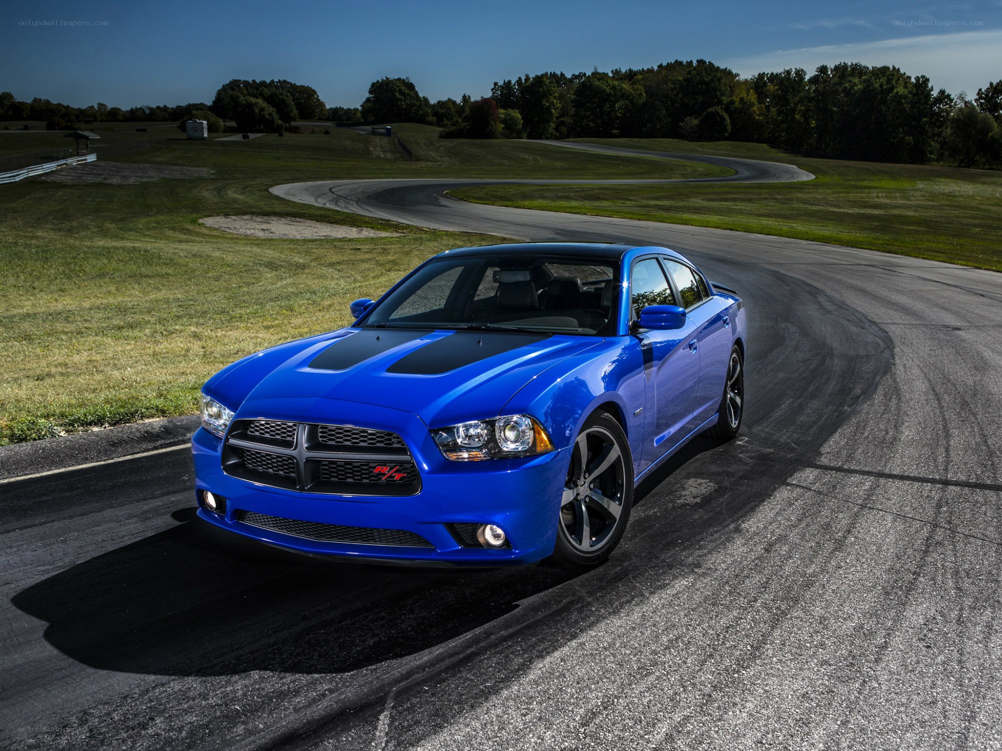 Blue Dodge Charger on a racetrack
