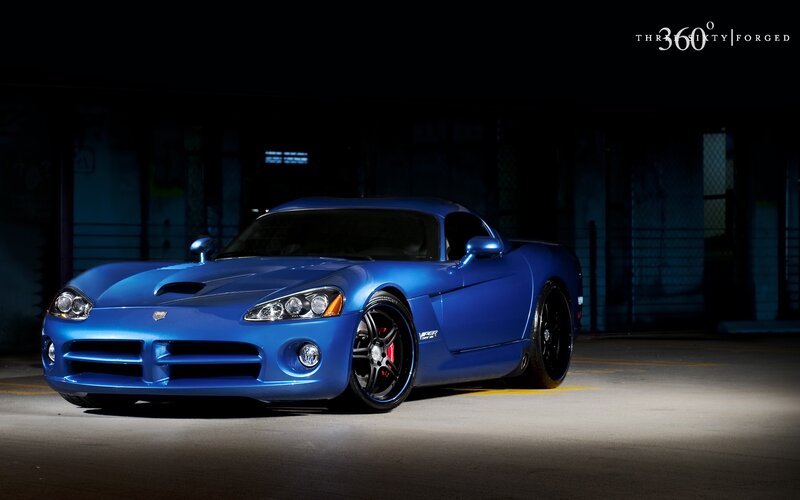 Blue Dodge Viper in dark garage