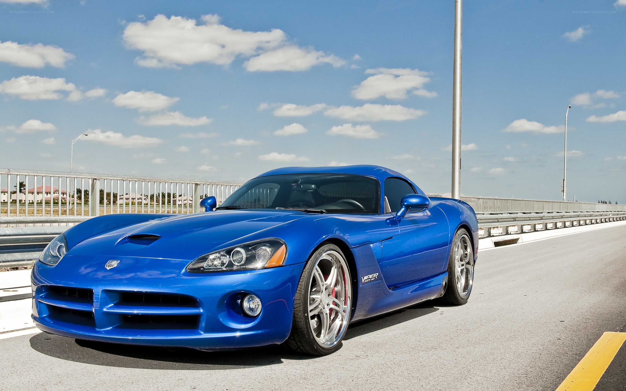 Blue Dodge Viper on a bridge