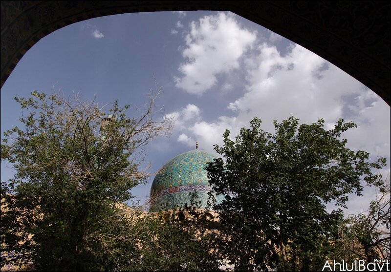 Blue dome mosque through arch