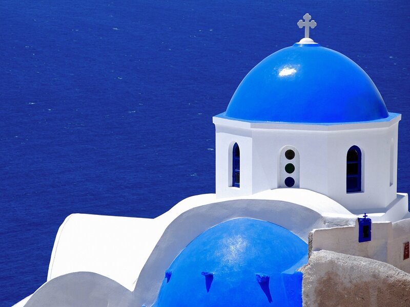 Blue-domed church by the sea