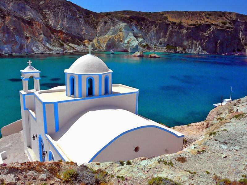Blue-domed church by the sea