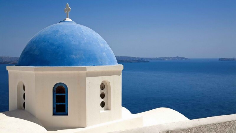 Blue-domed church overlooking the sea