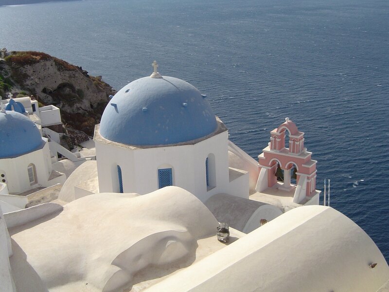 Blue-domed church overlooking the sea