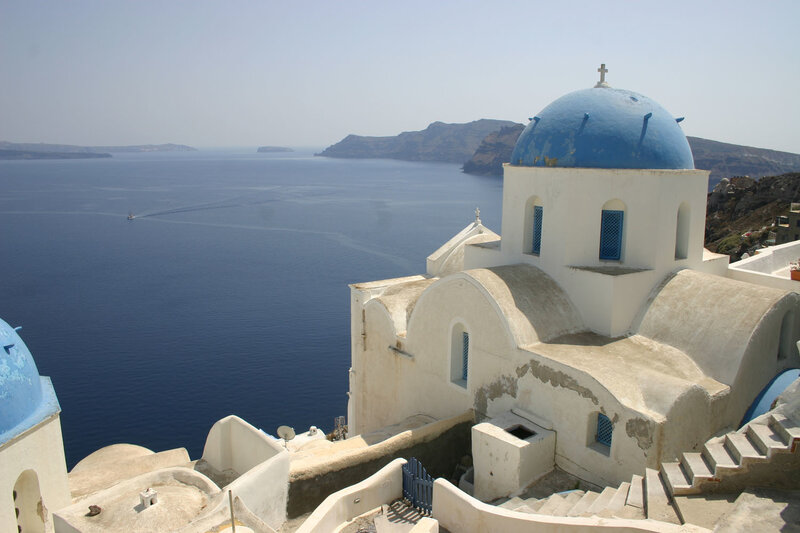 Blue-domed church overlooking the sea