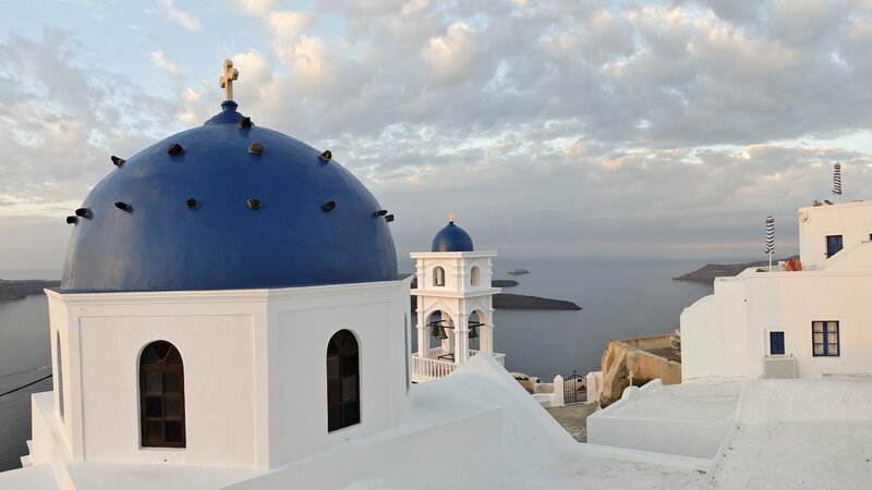 Blue-domed church overlooking the sea