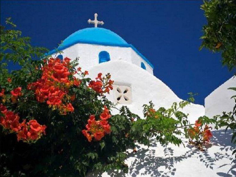 Blue-domed church with flowers