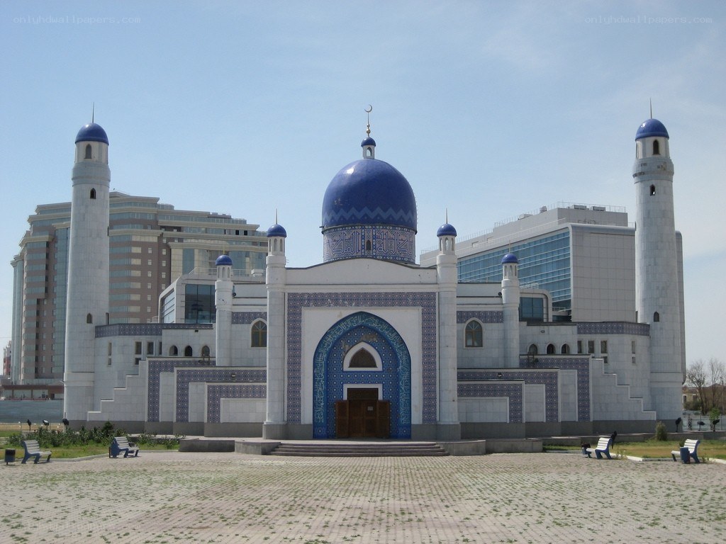 Blue-domed mosque in urban setting