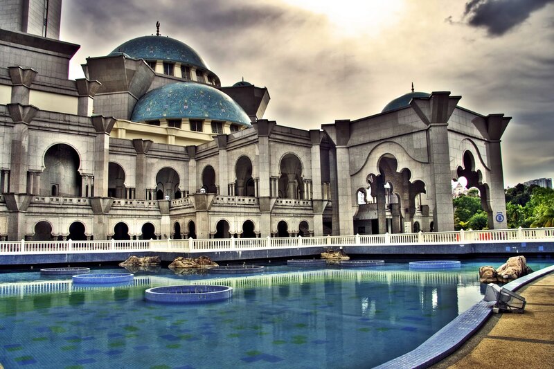 Blue-domed mosque with reflecting pool
