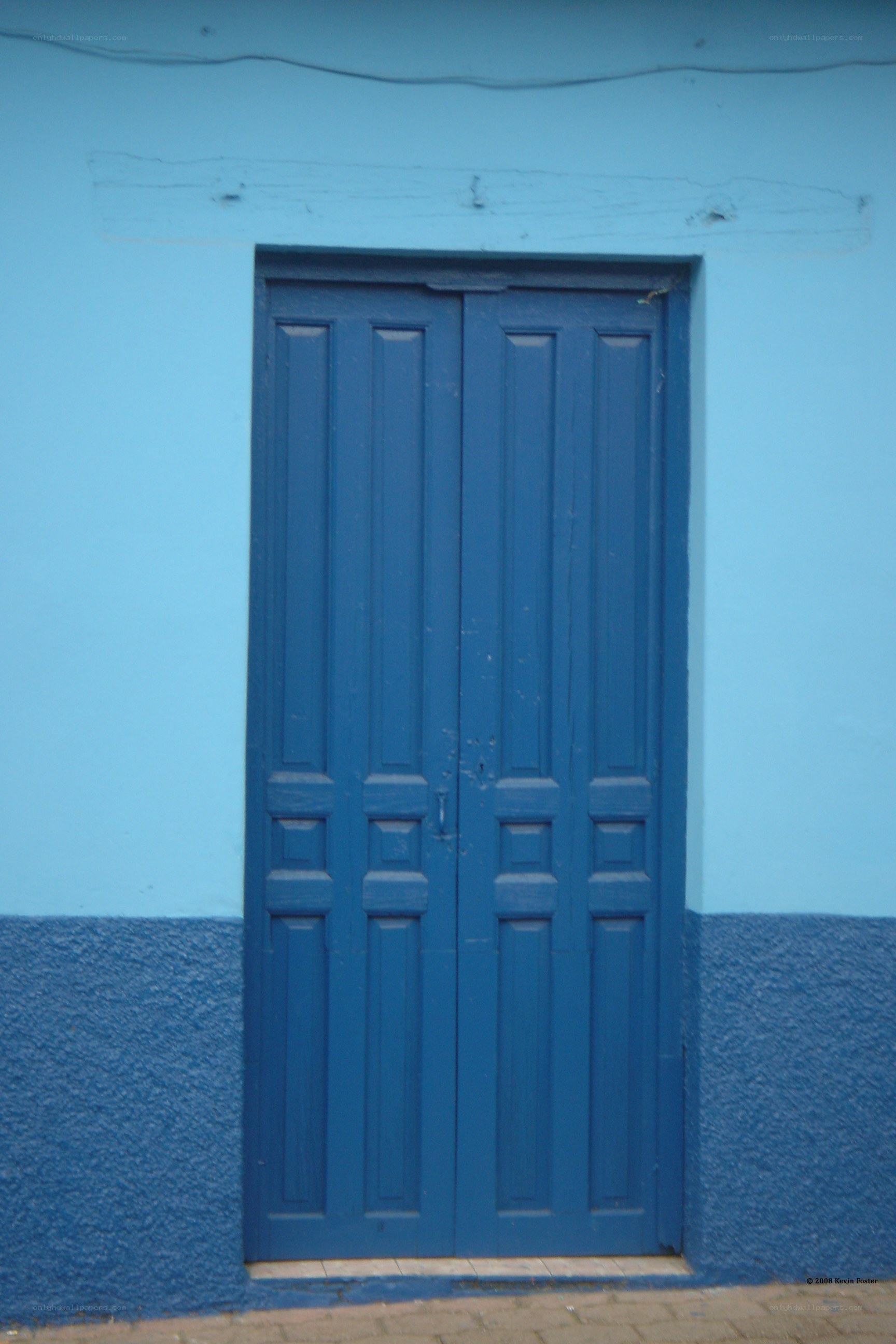 blue door on a blue wall