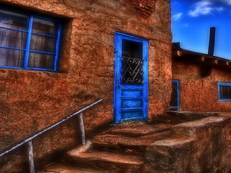Blue door on adobe building