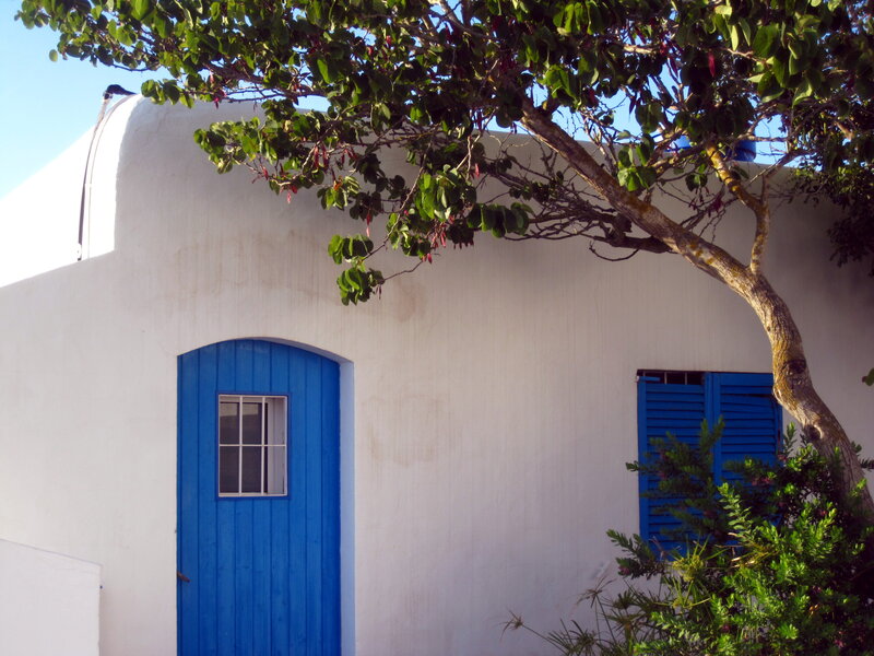 Blue Door on White Wall — Serene