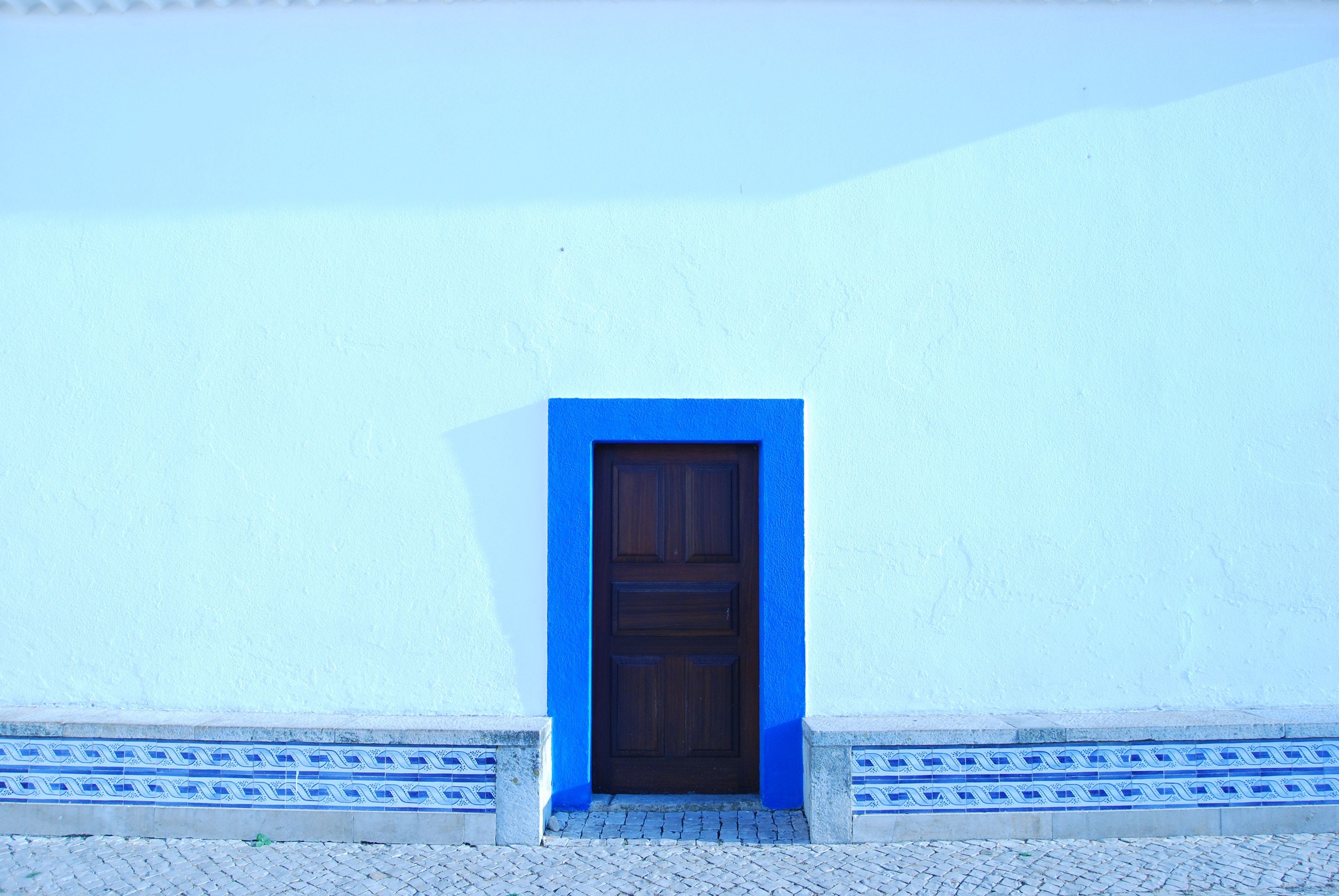 Blue door on white wall