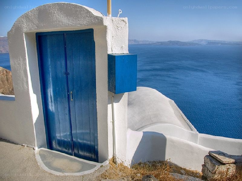 Blue door overlooking the sea