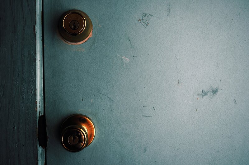 blue door with brass hardware