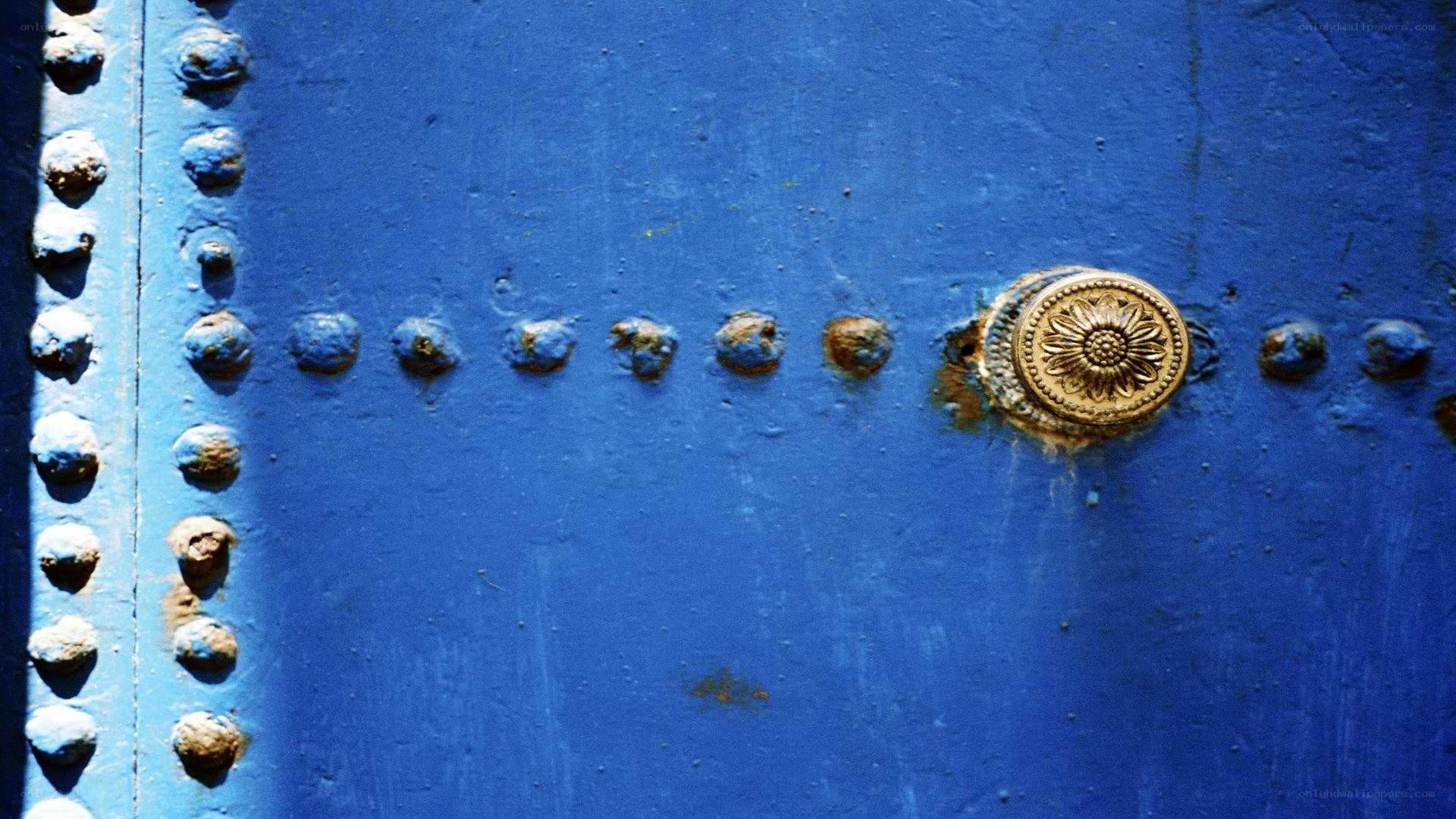blue door with brass knob