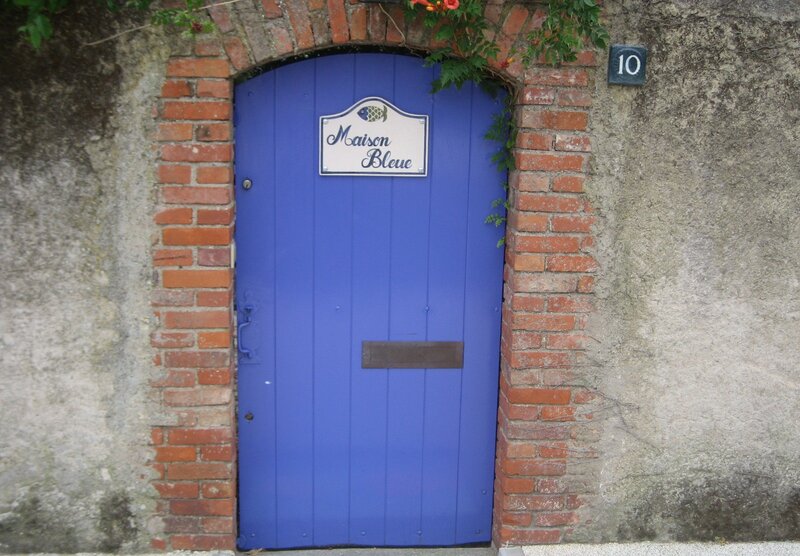 Blue Door with Sign