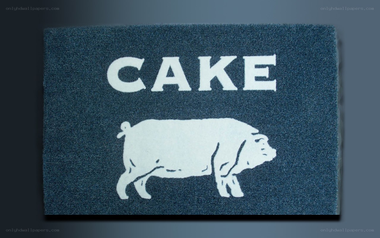 blue doormat with cake and pig