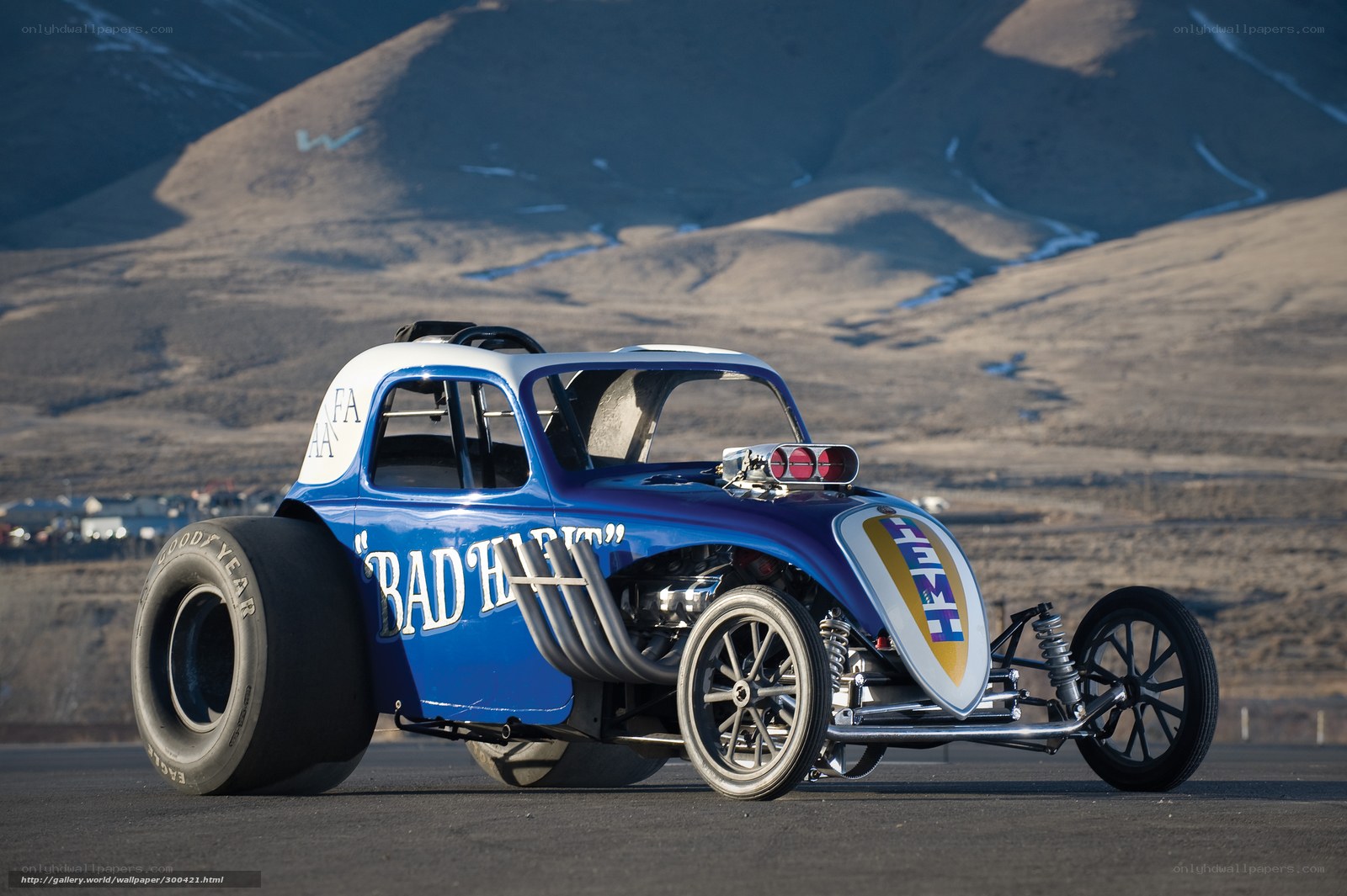 Blue drag racing car on track