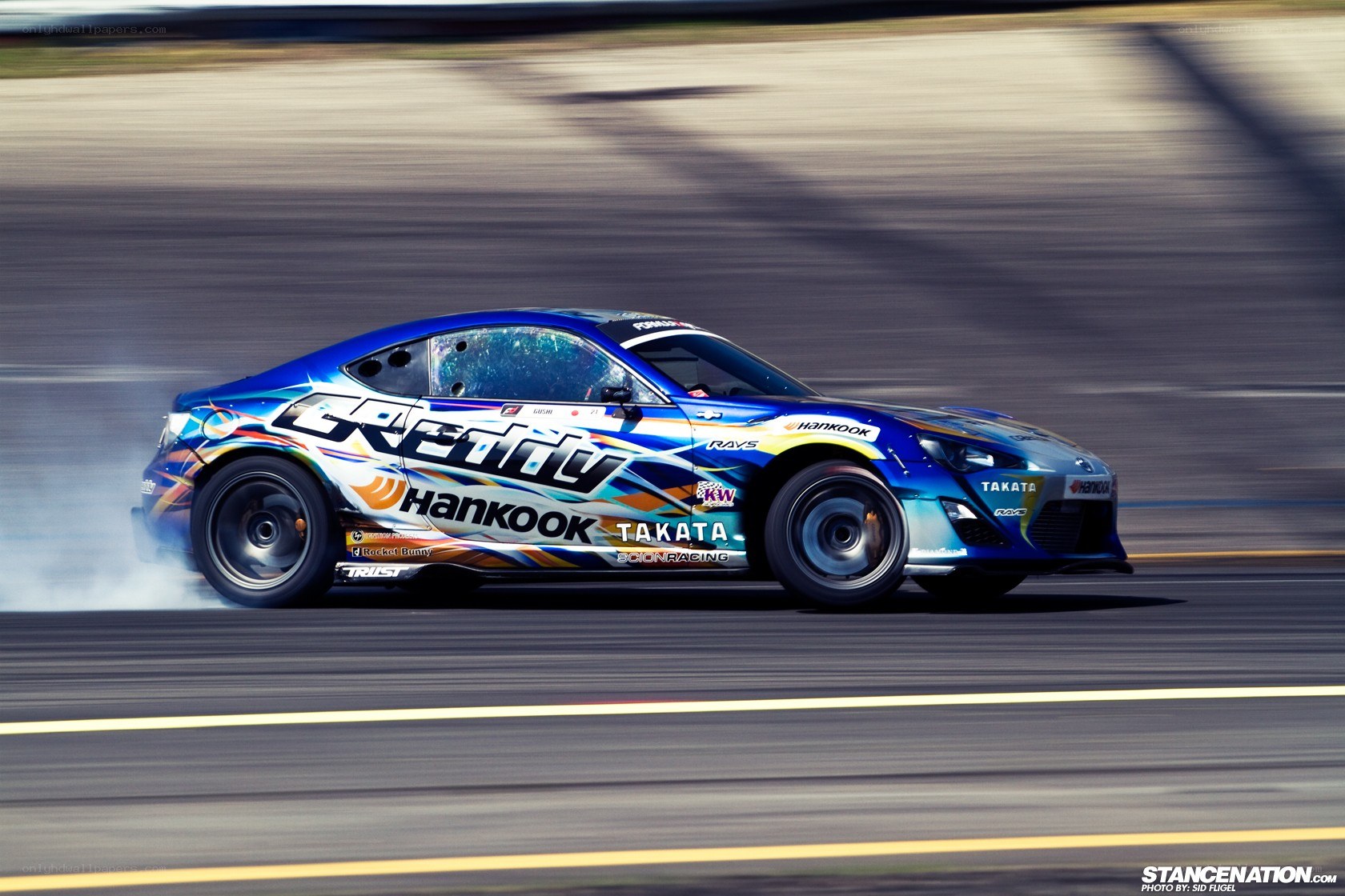 blue drift car on track