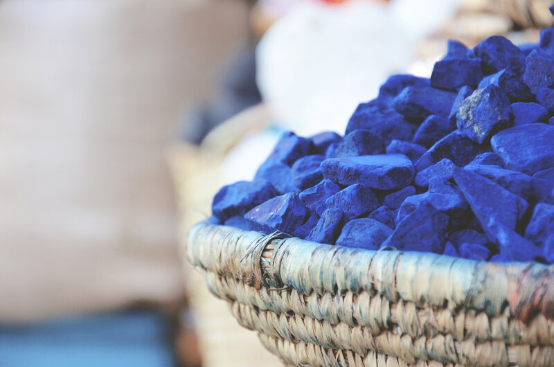 Blue dye stones in a basket