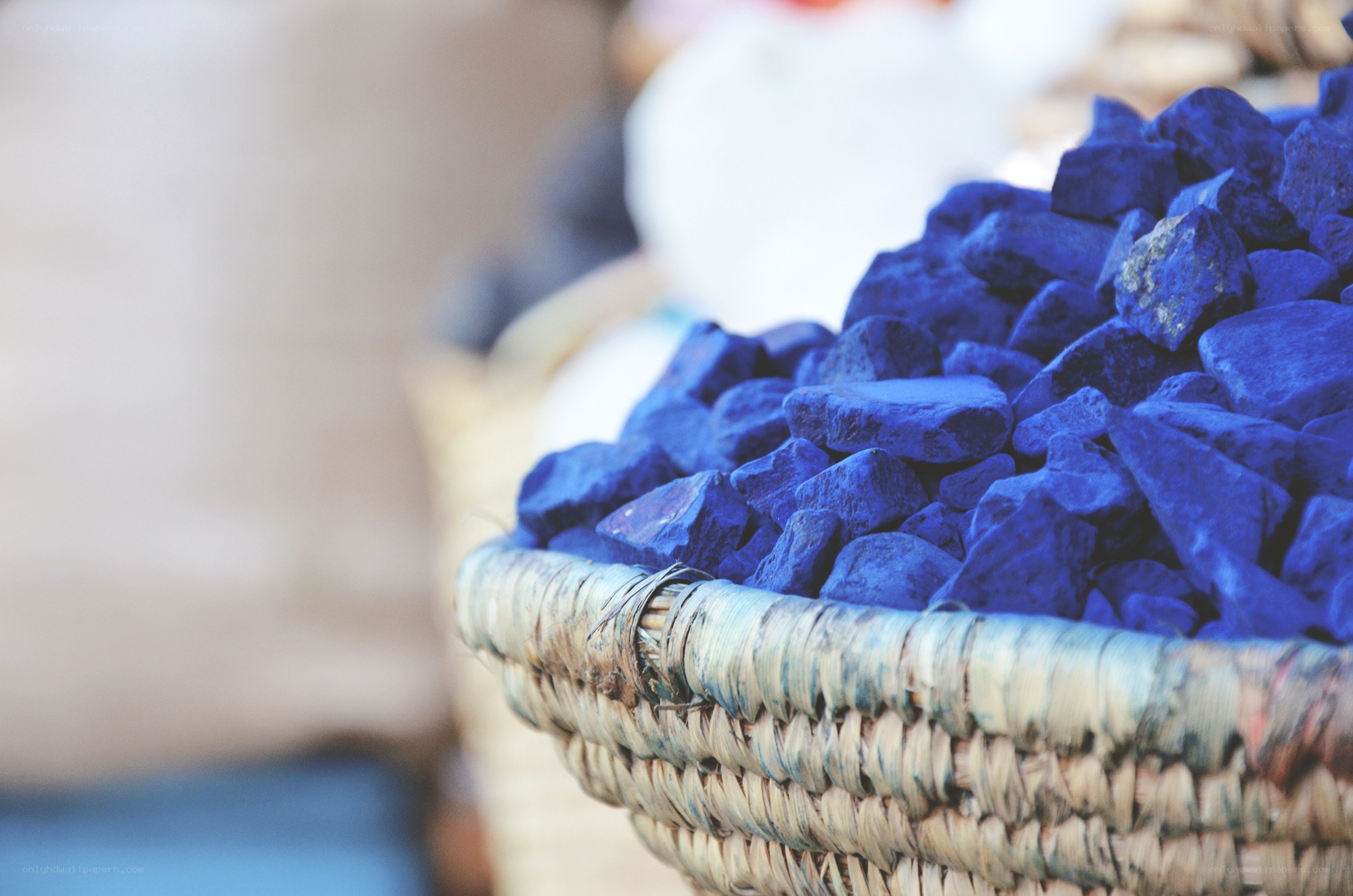 Blue dye stones in a basket