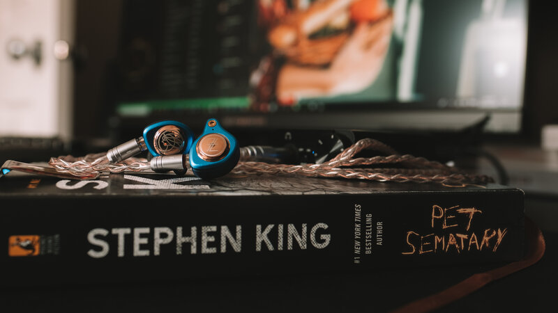 Blue Earphones on Book