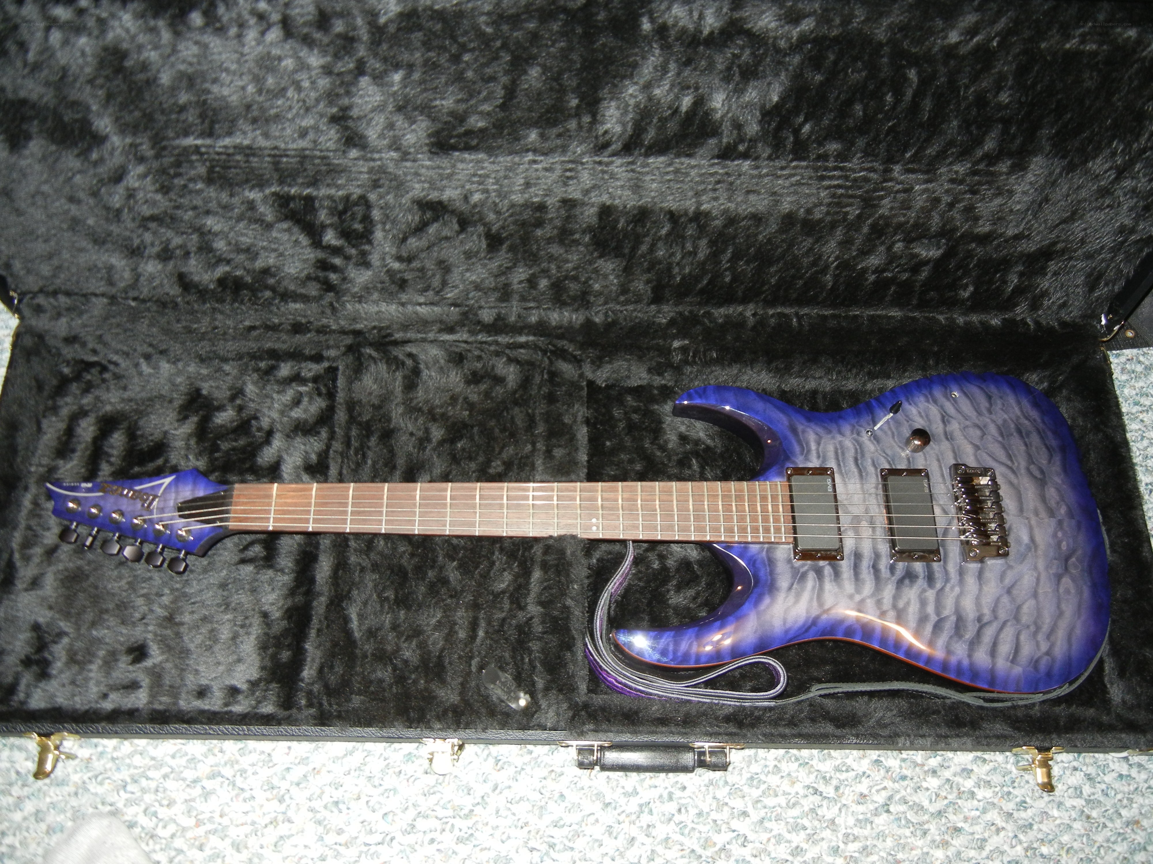blue electric guitar in case