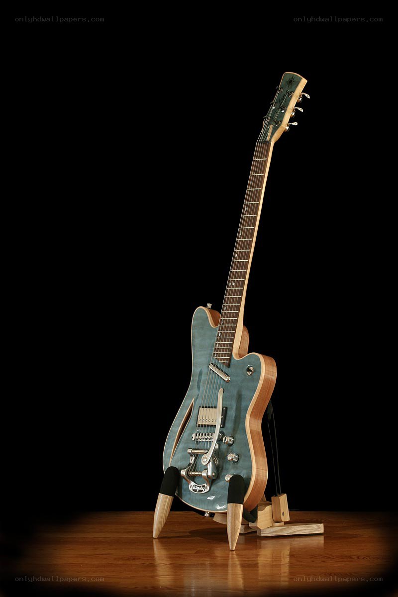 blue electric guitar on stand