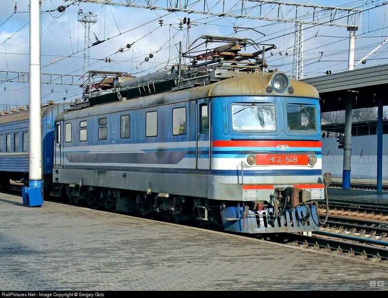 Blue electric locomotive at station