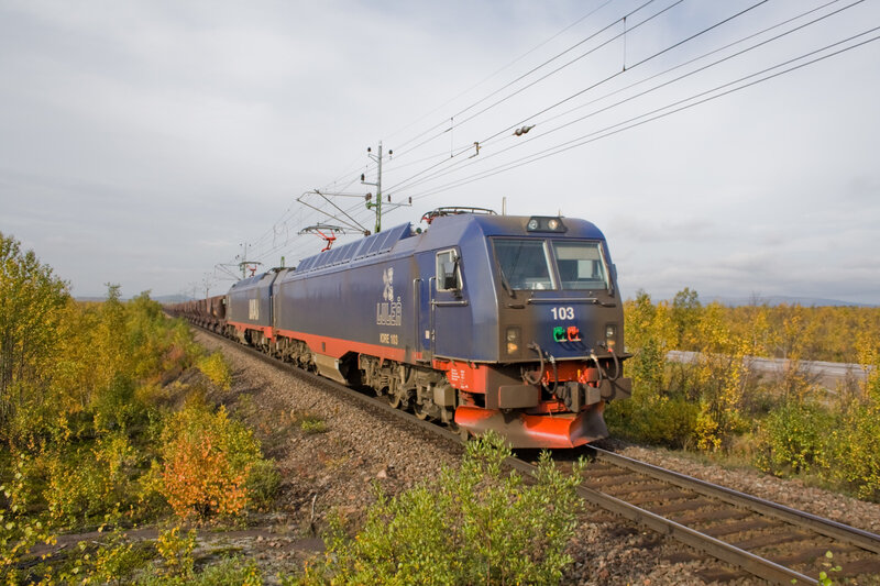 Blue electric locomotive on a railway