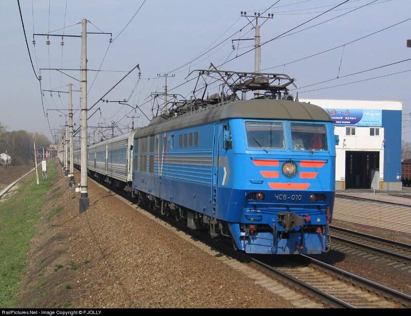 Blue electric locomotive on tracks