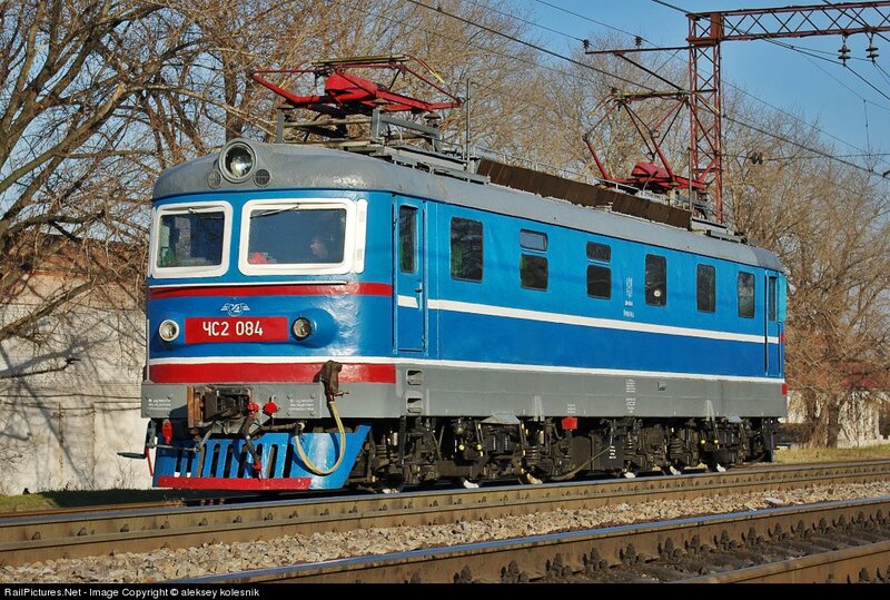Blue electric locomotive on tracks