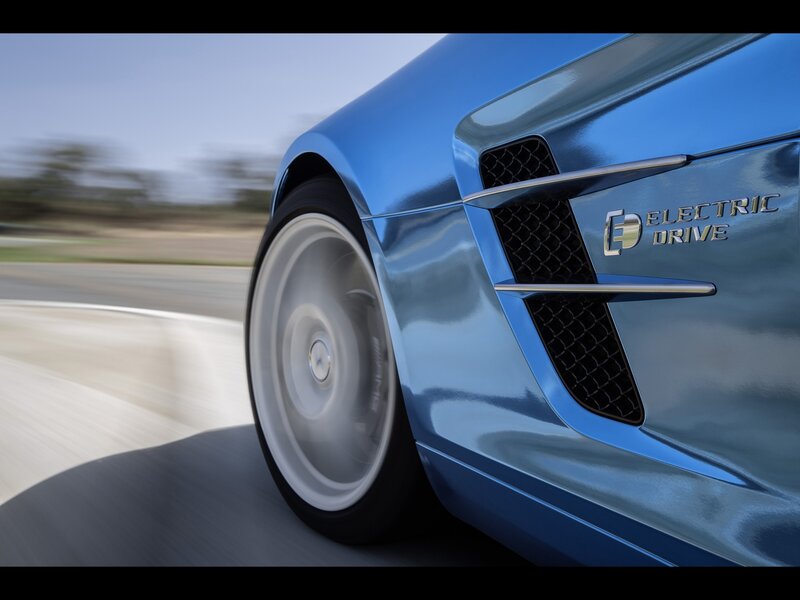 Blue electric sports car in motion