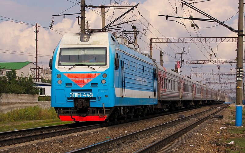 Blue electric train on tracks