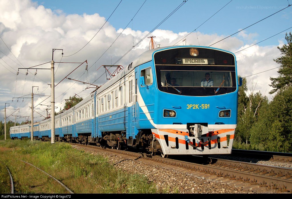 Blue electric train on tracks