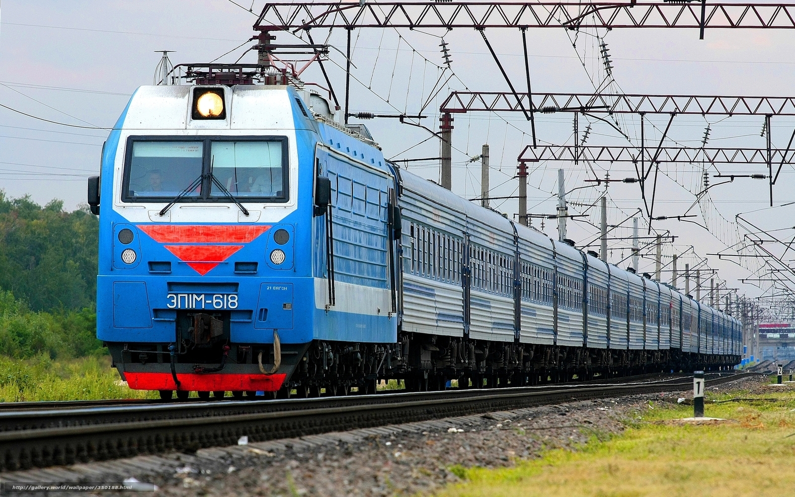 Blue electric train on tracks