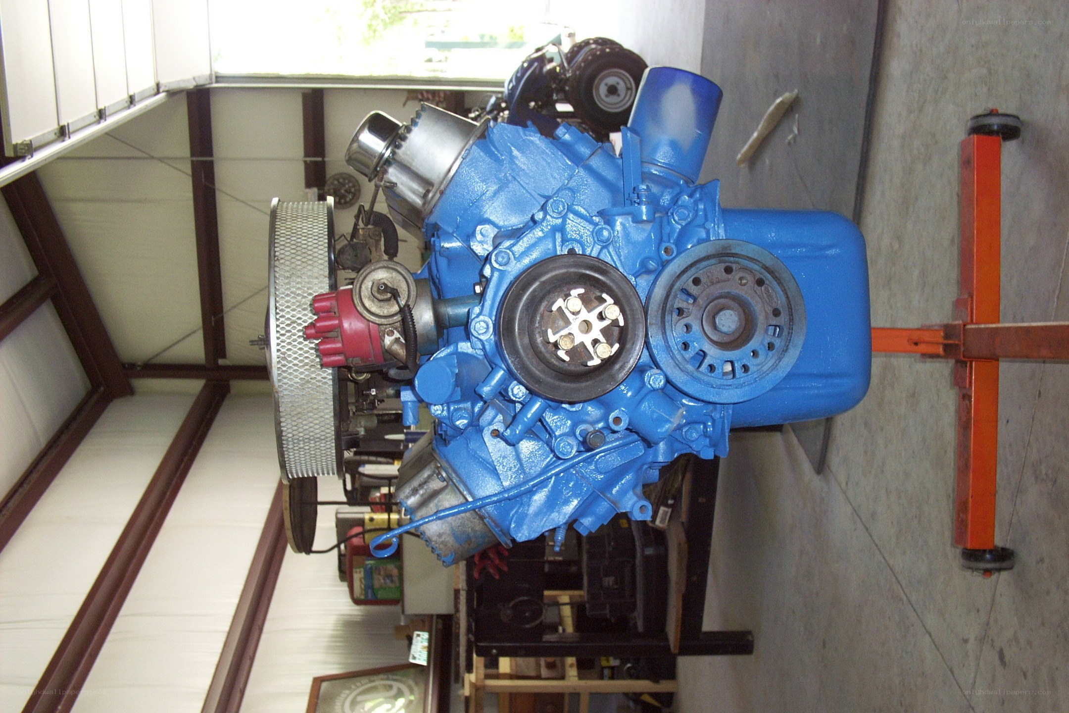 blue engine on a stand