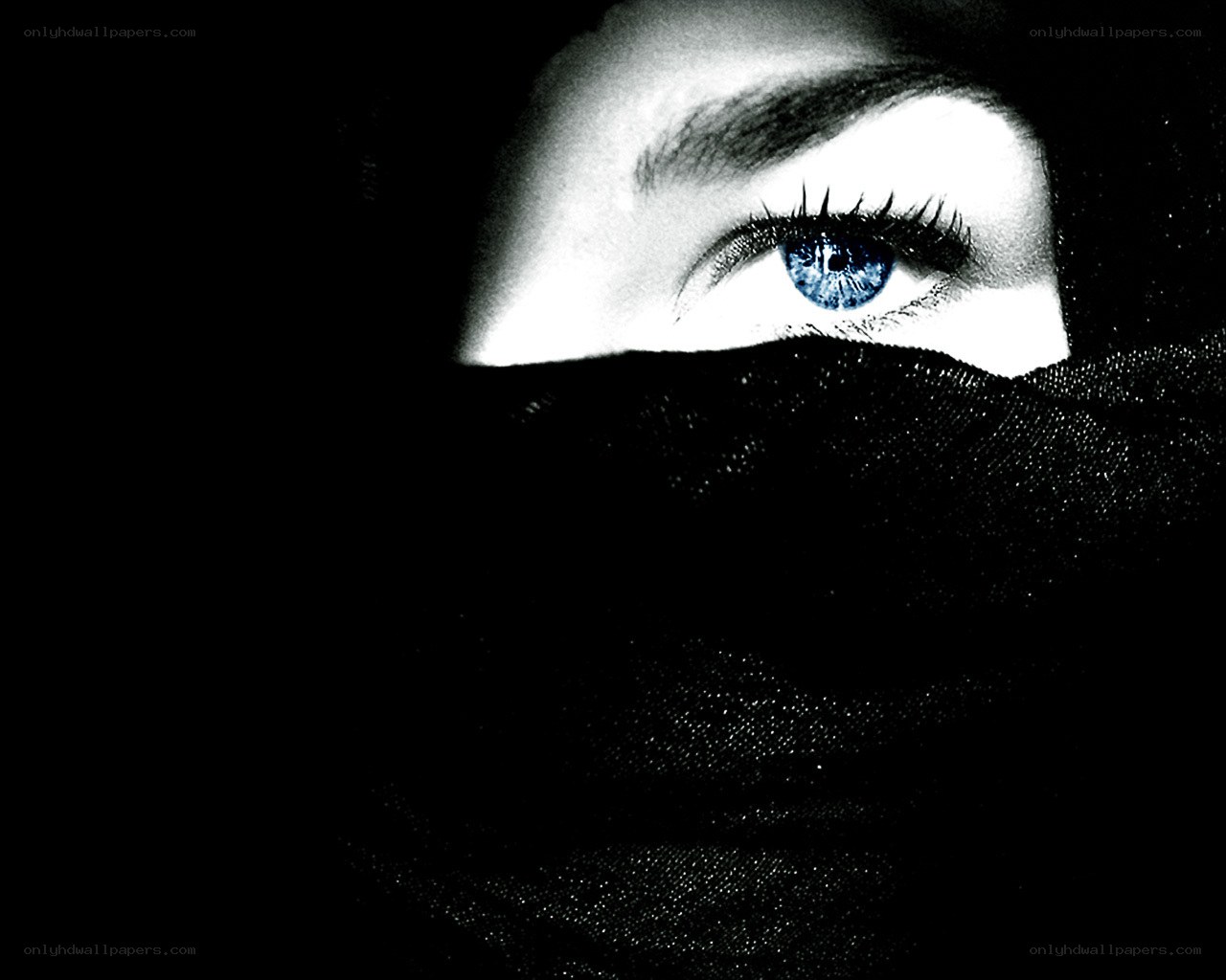 blue eye under black cloth