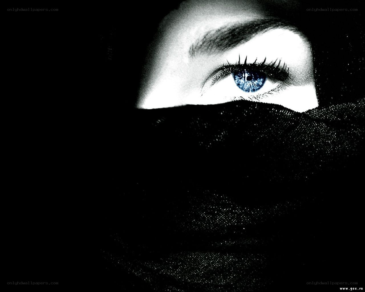 blue eye under black veil
