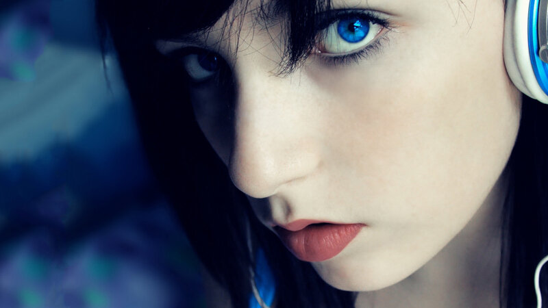blue-eyed woman with headphones