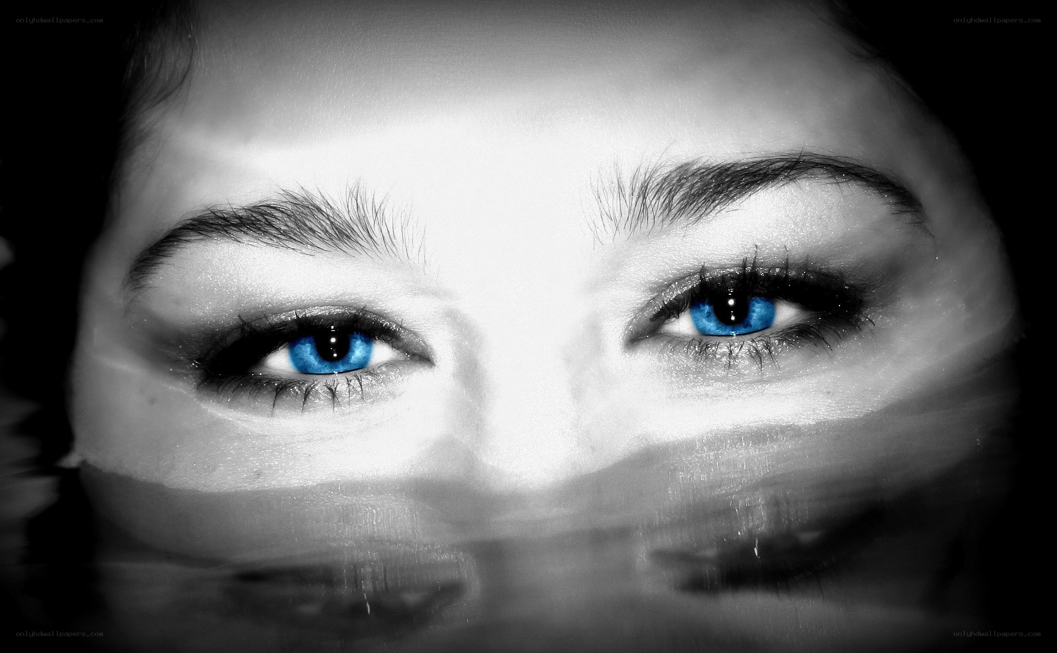 blue eyes in water reflection
