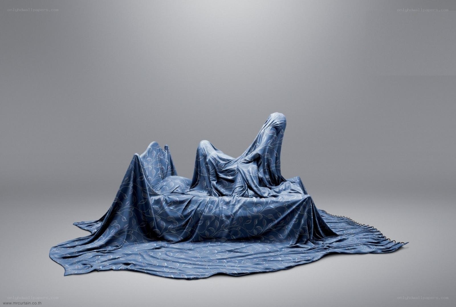 Blue fabric sculpture on gray background