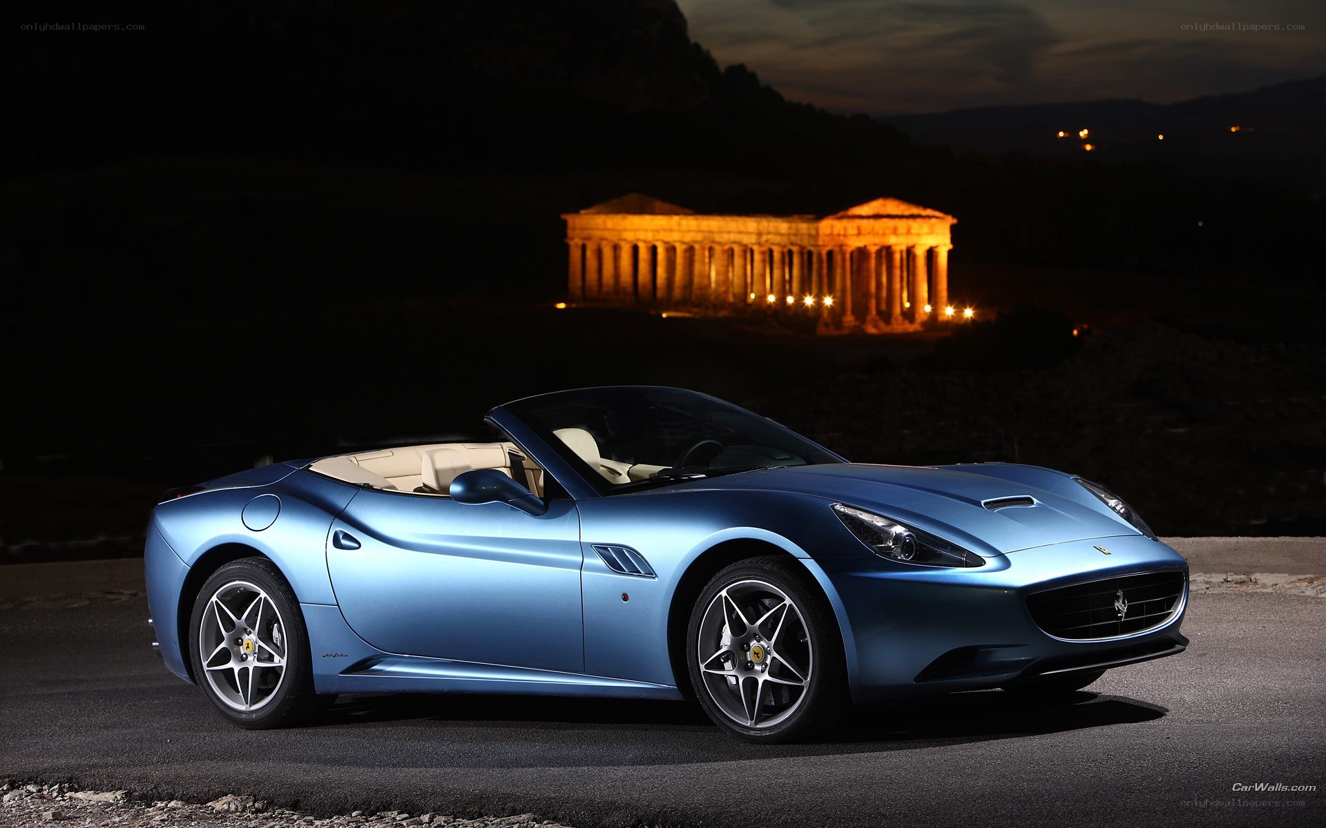 Blue Ferrari at night
