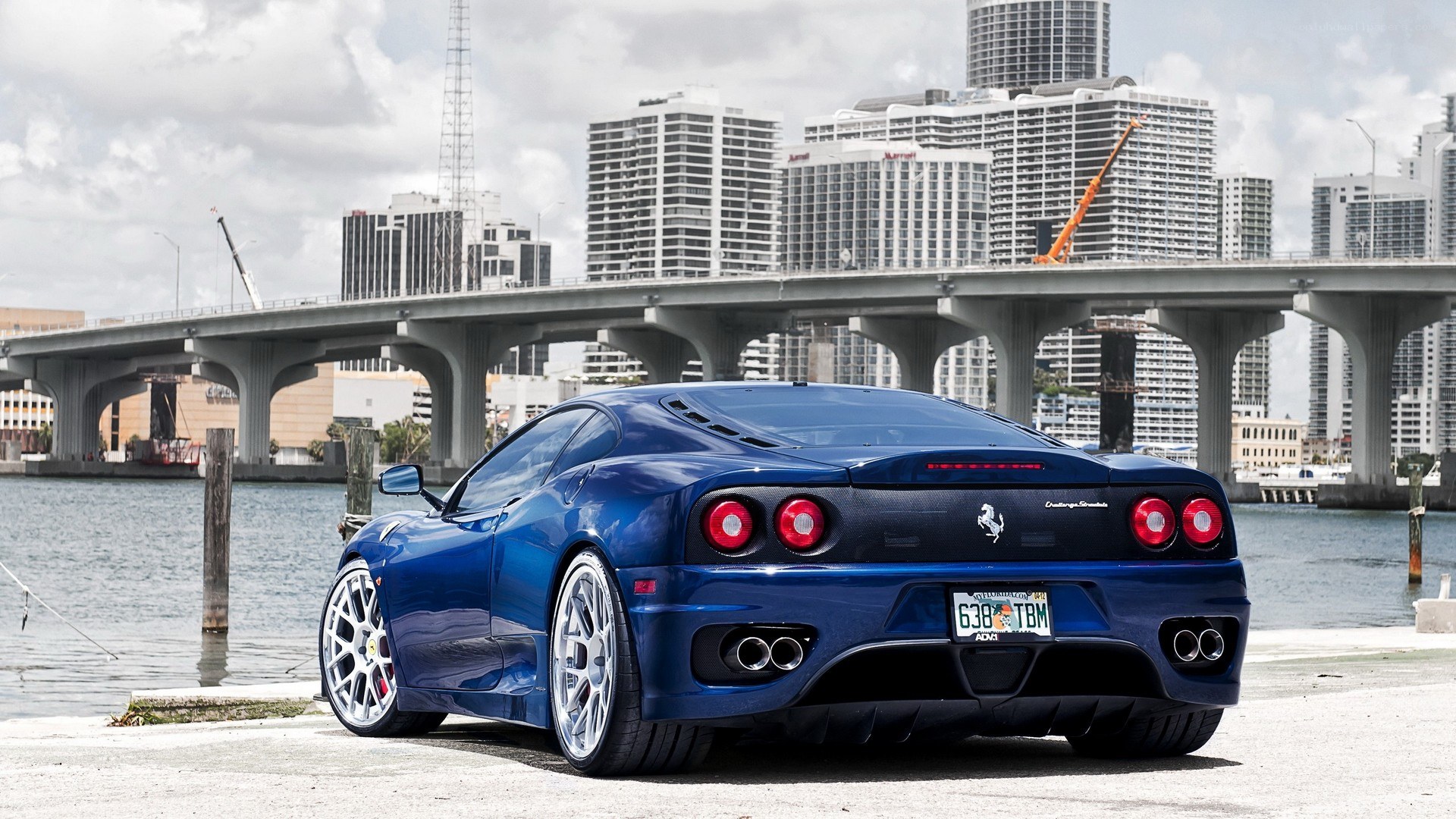 blue ferrari at waterfront