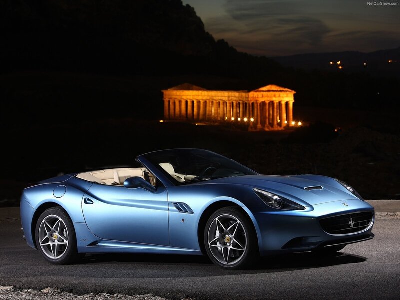Blue Ferrari California at night