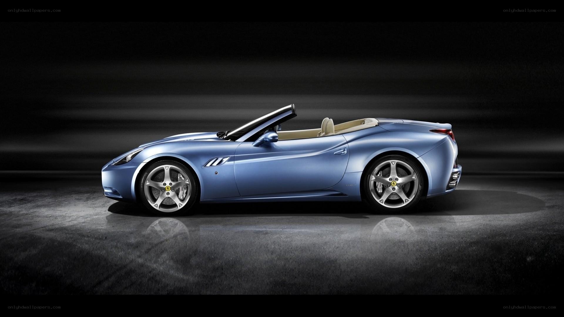 blue ferrari convertible car