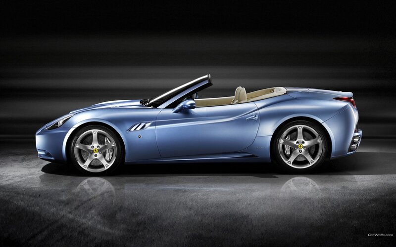 blue ferrari convertible sports car